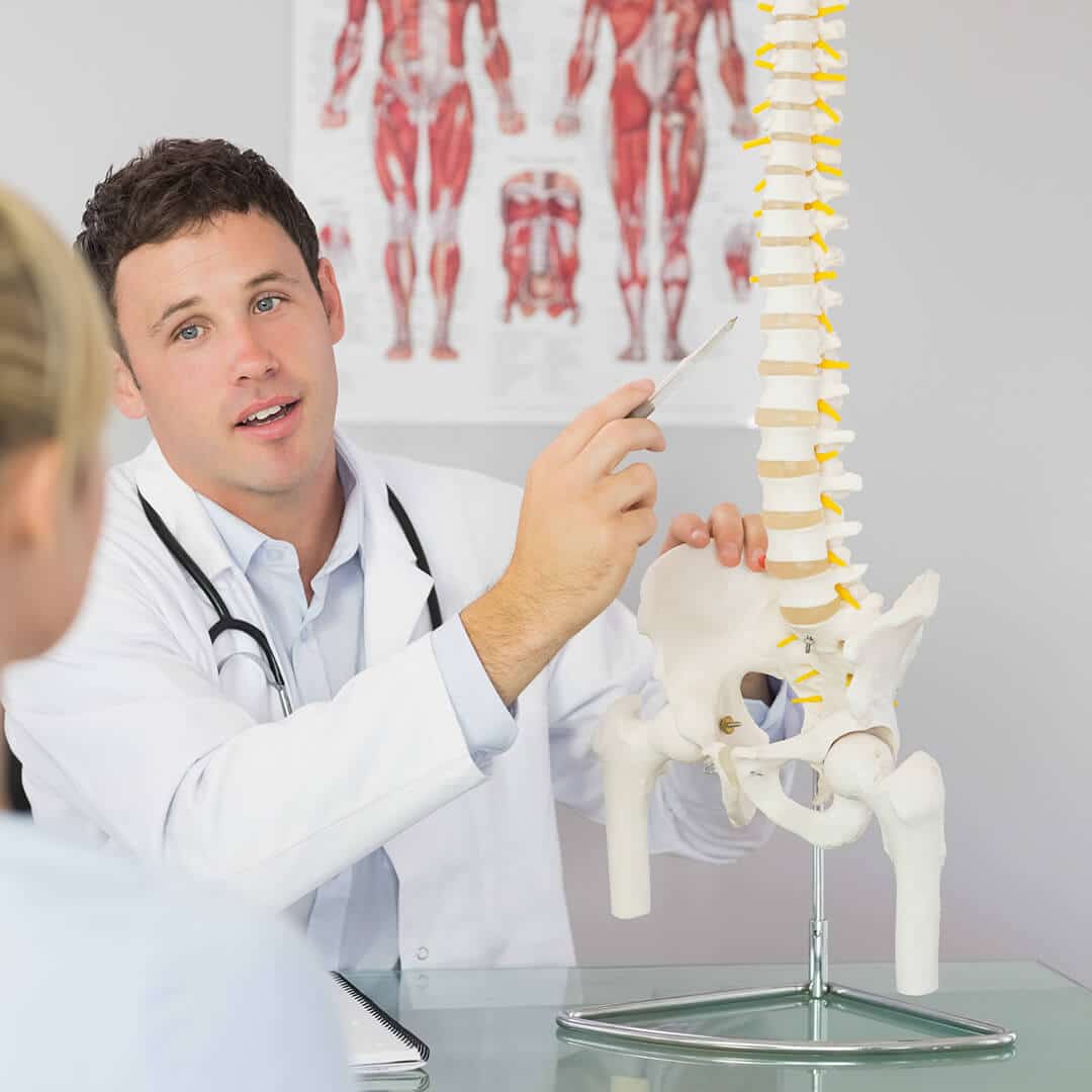 Chiropractor with a patient